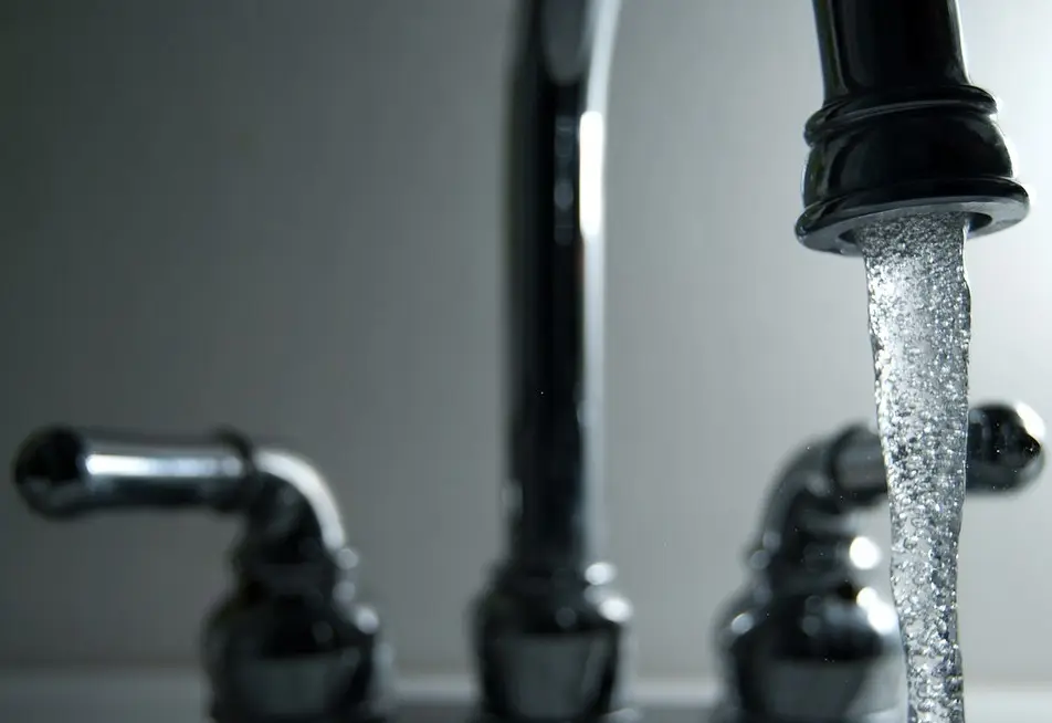 Chrome faucet with running water
