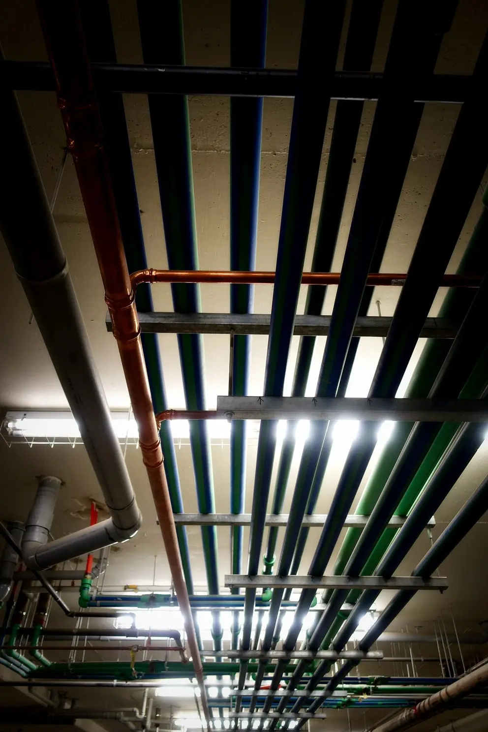 Metal water pipes along a building wall